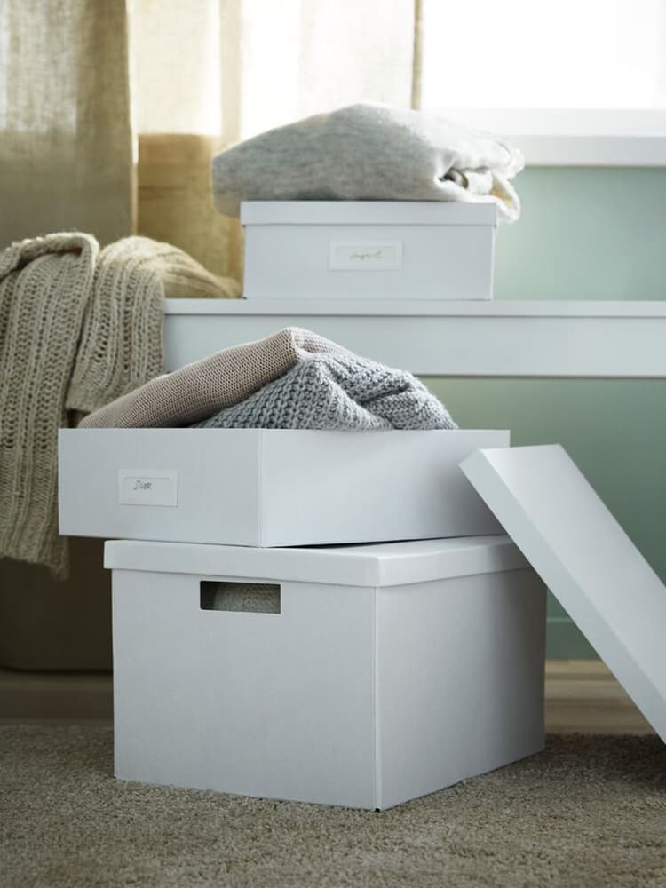 Two boxes full with clothes
