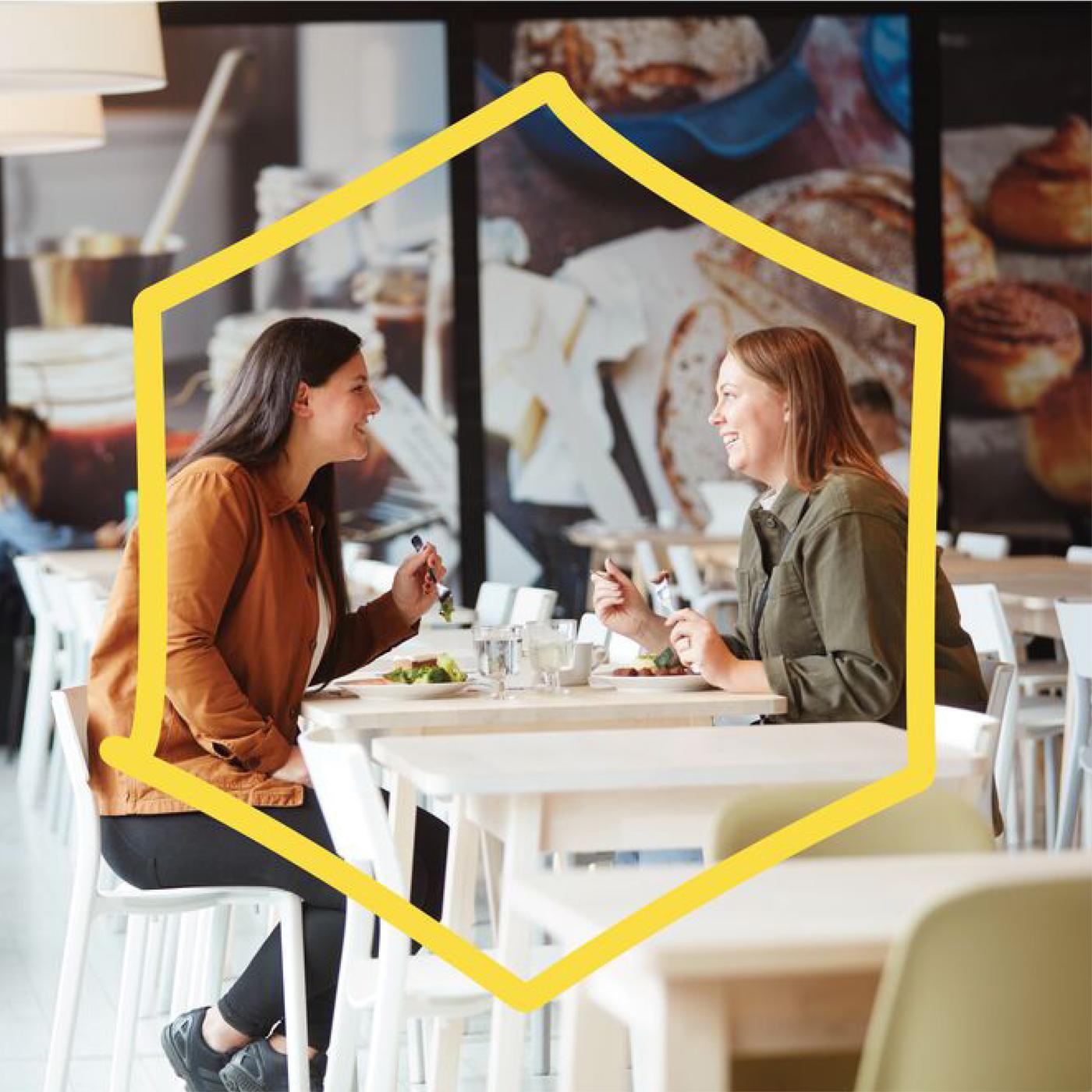 Two customers eating at the Swedish restaurant.