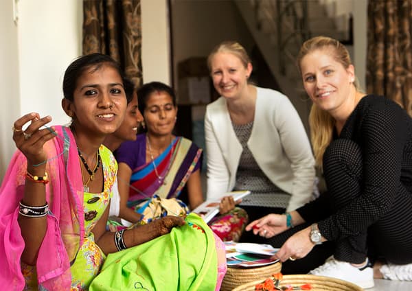 Two IKEA designers are sitting together with two Indian artisans, talking about a collection they are co-creating.