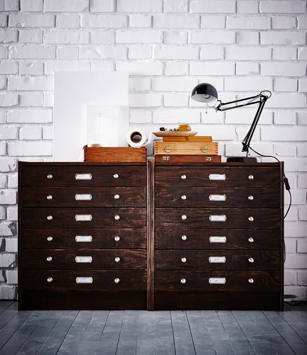 Two IKEA RAST chests stand against a white brick wall. They’ve been hacked to look like vintage filing cabinets.