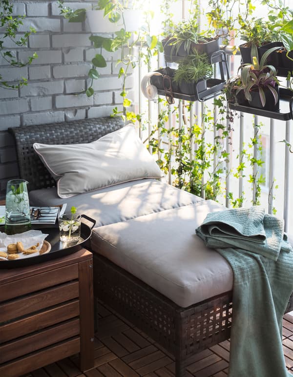 Two modular sections form a chaise lounge for sunbathing on an outdoor patio