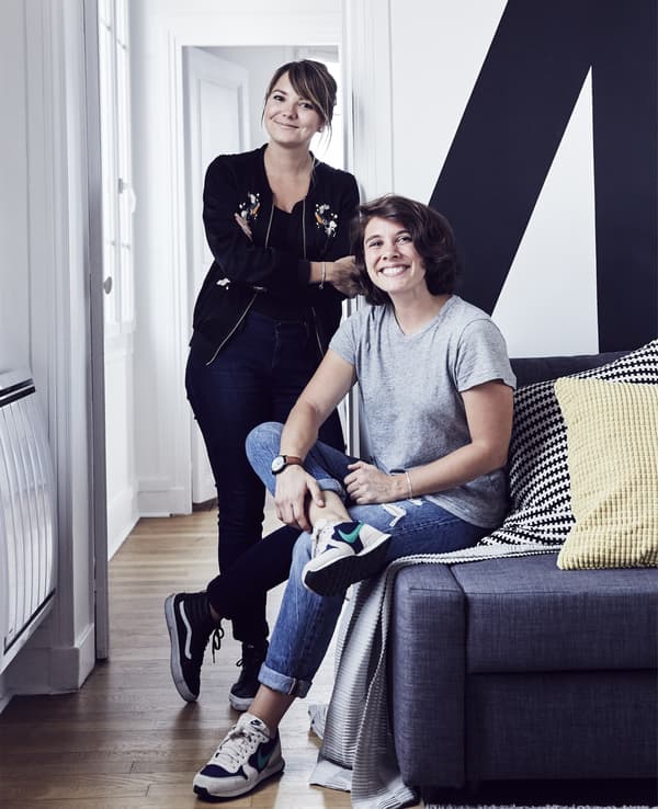 Two women in a living room.