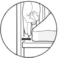Un diagrama de dos dedos entre un colchón y una cabecera para mostrar cuánto espacio debe haber.