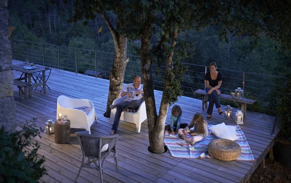Use blankets and rugs to soften outdoor areas 