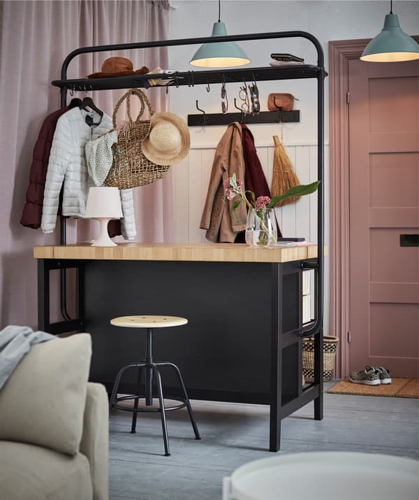 VADHOLMA can work double shifts as room divider and hallway logistics center in an open-plan home, holding coats, accessories – and seating space.