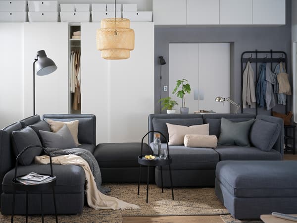 VALLENTUNA sofa and white cabinets in the living room.