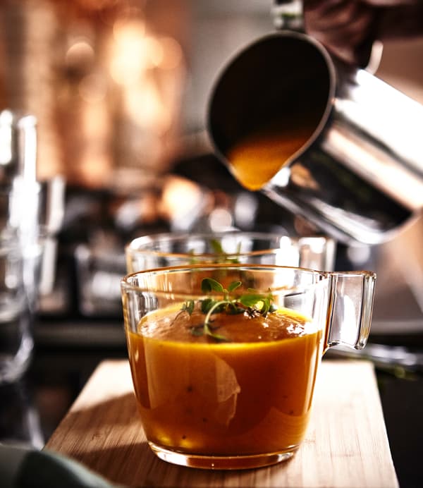 Vegetable puree soup is presented in IKEA STELNA mugs.