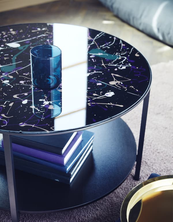 VITTSJÖ coffee table splatter-painted in pink, purple and white.