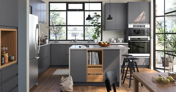 VOXTORP kitchen in dark grey with a smooth door with integrated handles.