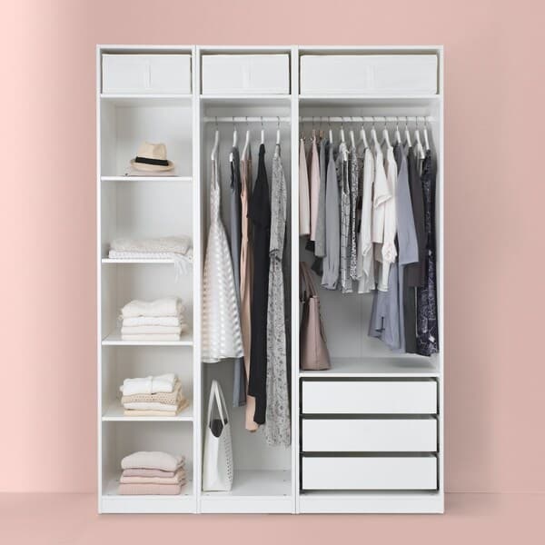 white closet with shelves and drawers