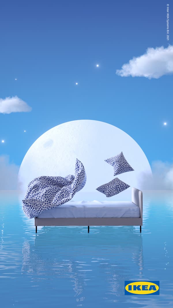 White/dark blue, leopard print KVASTFIBBLA bedding rises above a SLATTUM bed that floats on blue water against a rising moon.