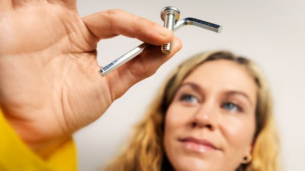 Woman holding up an allen key