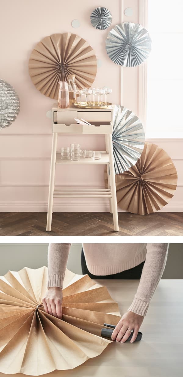 You can make a rosette backdrop from holiday products like GIVANDE gift wrap roll natural from IKEA. 