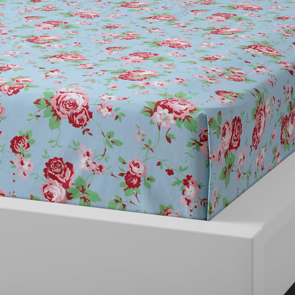 Blue bedspread with red and pink roses on light blue background. Soft cotton, breathable, absorbent.