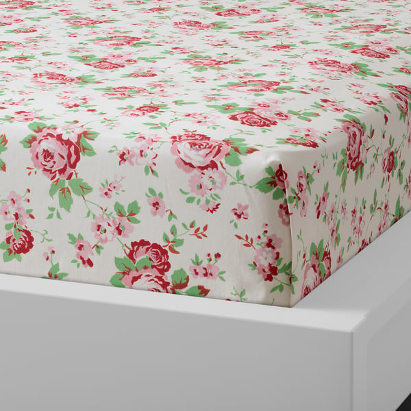 Floral printed bed sheet, made of 100% cotton, soft and breathable, displayed on a white bed.