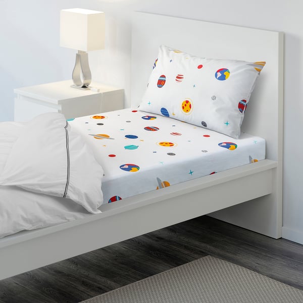 AFTONSPARV space-themed bed set in vibrant colours on white background, soft cotton blend, standard size, perfect for kids room.