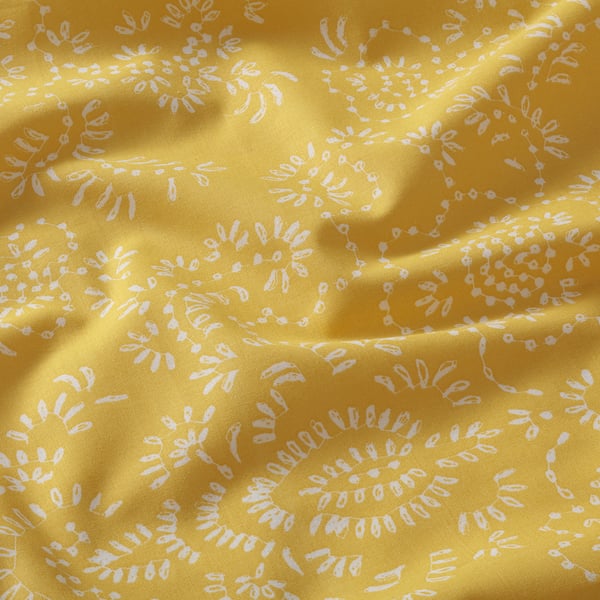 Bright yellow fabric with intricate white floral patterns, soft and natural, high-quality cotton material.