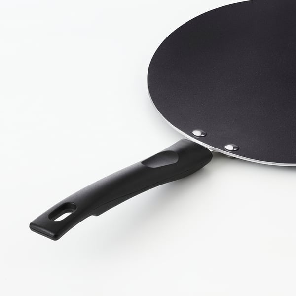 Black frying pan with a large silicone handle and a dark, smooth cooking surface.