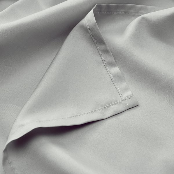Close-up of soft, grey BÄRGLIM bed sheet, showcasing smooth, wrinkle-free texture and quality stitching.