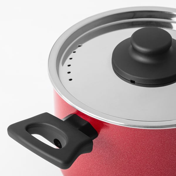 Red pot with black handle and lid, featuring a sleek design and durable non-stick coating, ideal for even heat distribution.