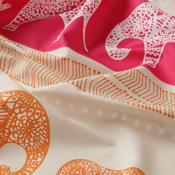 Bright, durable bedsheet featuring vibrant elephant and circular designs in red/pink and orange, showcasing intricate patterns.