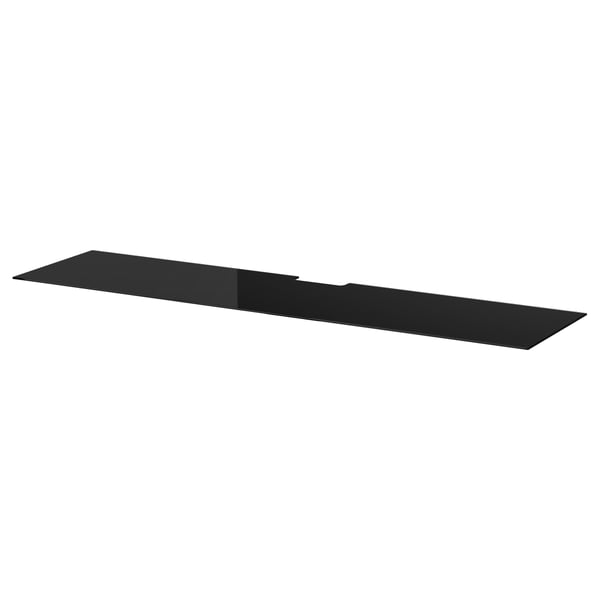A black glass shelf, sleek and minimalist, perfect for storage.