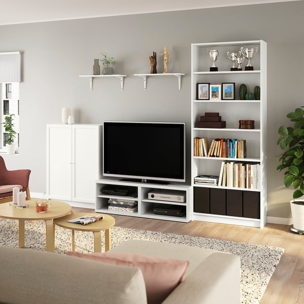 White tv bench with BILLY units, books, decor.
