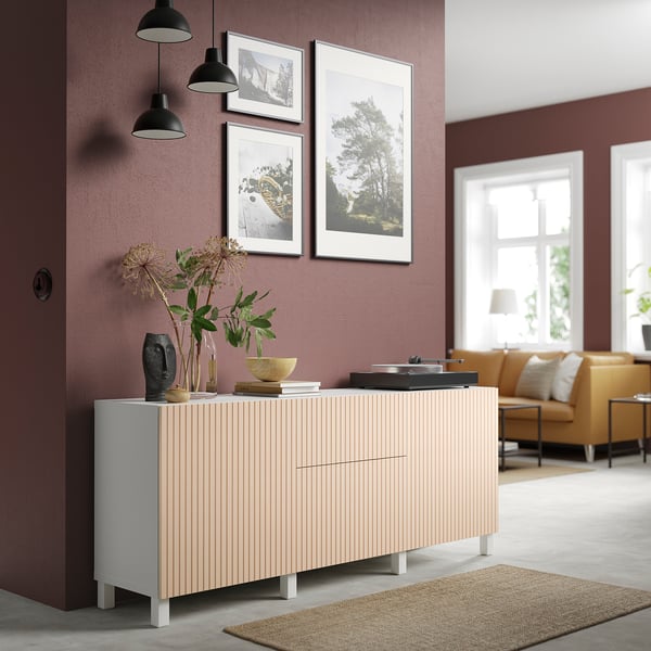 Modern living room with BJÖRKÖVIKEN sideboard, photos, pendant lights, yellow sofa, and decorative vases.