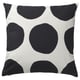 Black and white square cushion with large dots. Modern, minimalist decor. Hidden zip closure.