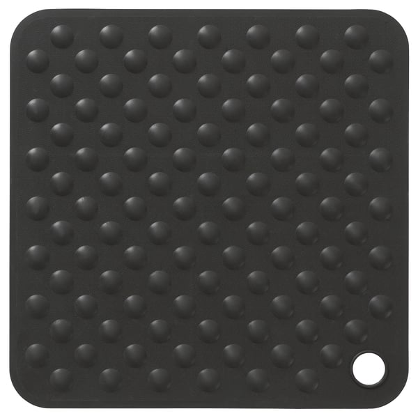 A black square BLÅSJÖN bathtub mat with numerous suction cups for secure grip, designed for safety and comfort in the bathroom.