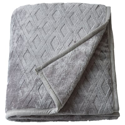 Folded soft grey blixxabacken blanket with textured diamond pattern, made from recycled polyester fleece, offering warmth and comfort.