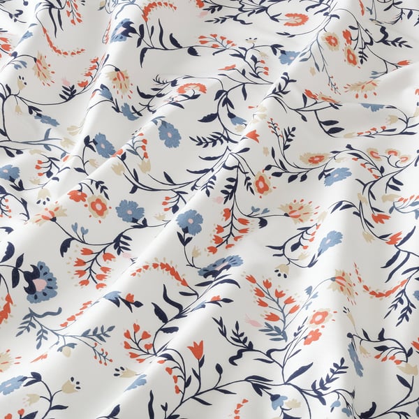 Floral bed sheet, high-quality cotton, white background, detailed patterns, soft texture.