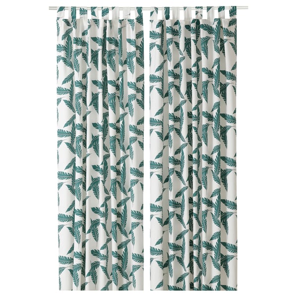BUSKMÄTARE: green leaf-print curtains with eyelet heading, made of cotton.