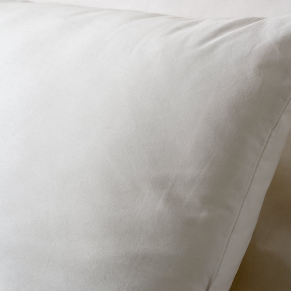 Soft, white cushion with smooth, support-ready surface; quality polyester for comfort, cotton cover for softness.