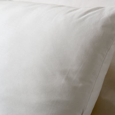 Soft, white cushion with smooth, support-ready surface; quality polyester for comfort, cotton cover for softness.