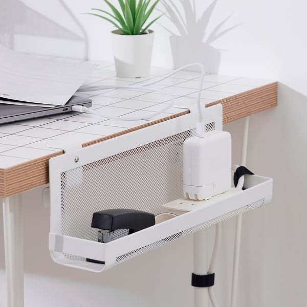 Desk cable tray with plant and electronics.