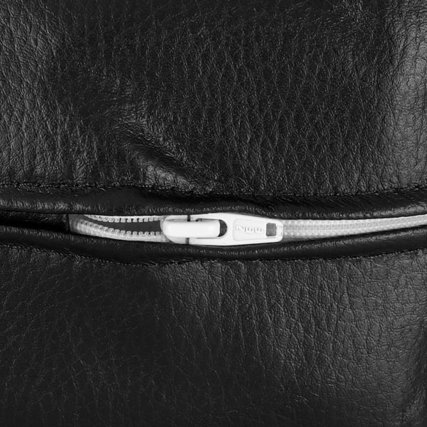 Sofa zip close-up with metal pull.