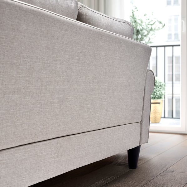 A modern, light grey sofa with wooden legs. The back is slightly angled for comfort. It sprung seats and polyester cushions for relaxation.