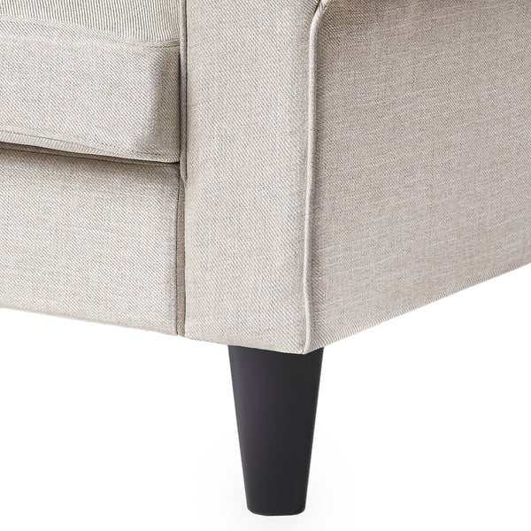 Modern light grey sofa with conical black legs, showcasing quality upholstery and sleek design.