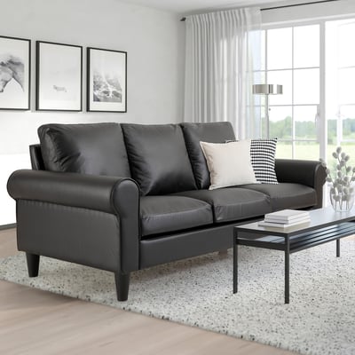 Modern living room with grey GAMMALBYN sofa, coffee table, white rug, large windows.