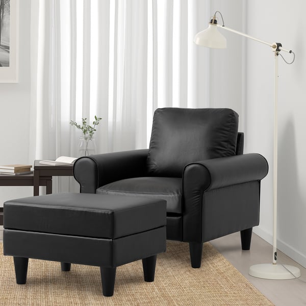 Gammalbẙn armchair & footstool, both in faux leather.