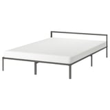 A GRIMSBU bed, white with a steel frame, featuring a low, square design.