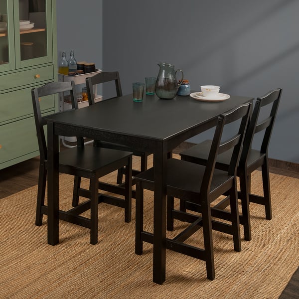 HÄGERNÄS: black, rectangular dining table. Seats 4. Solid mango wood, sleek design. Fits small spaces.