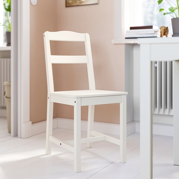 HAUGA white wooden armless dining chair, with ladder-back design.