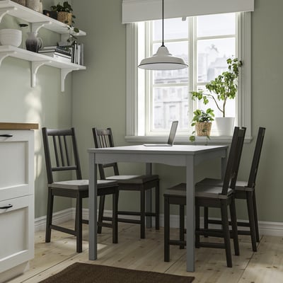 Small grey HAUGA dining set in cosy kitchen nook.