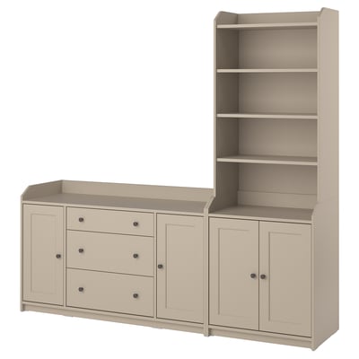 Beige HAUGA furniture set with drawers and bookcase in light beige, combining open and closed storage.
