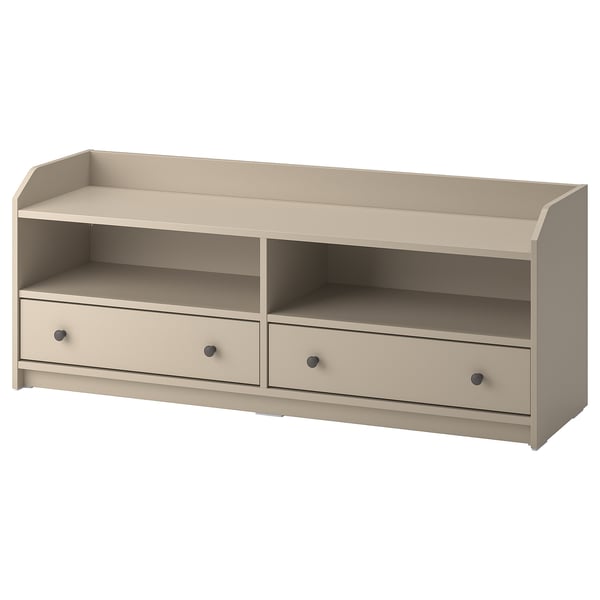 An off-white wooden tv bench from the ikea HAUGA series. It two drawers and open shelves for storage.