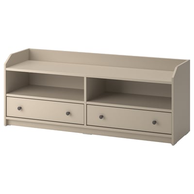 An off-white wooden tv bench from the ikea HAUGA series. It two drawers and open shelves for storage.