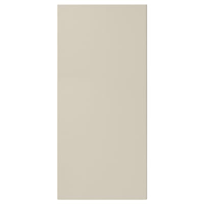 A rectangular beige HAVSTORP front panel. Its smooth, modern, and made from acrylic painted fibreboard.