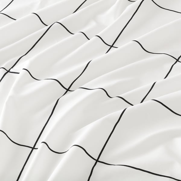 Black and white checked bedsheet, crisp, pure cotton. Soft, textured waves in black lines.